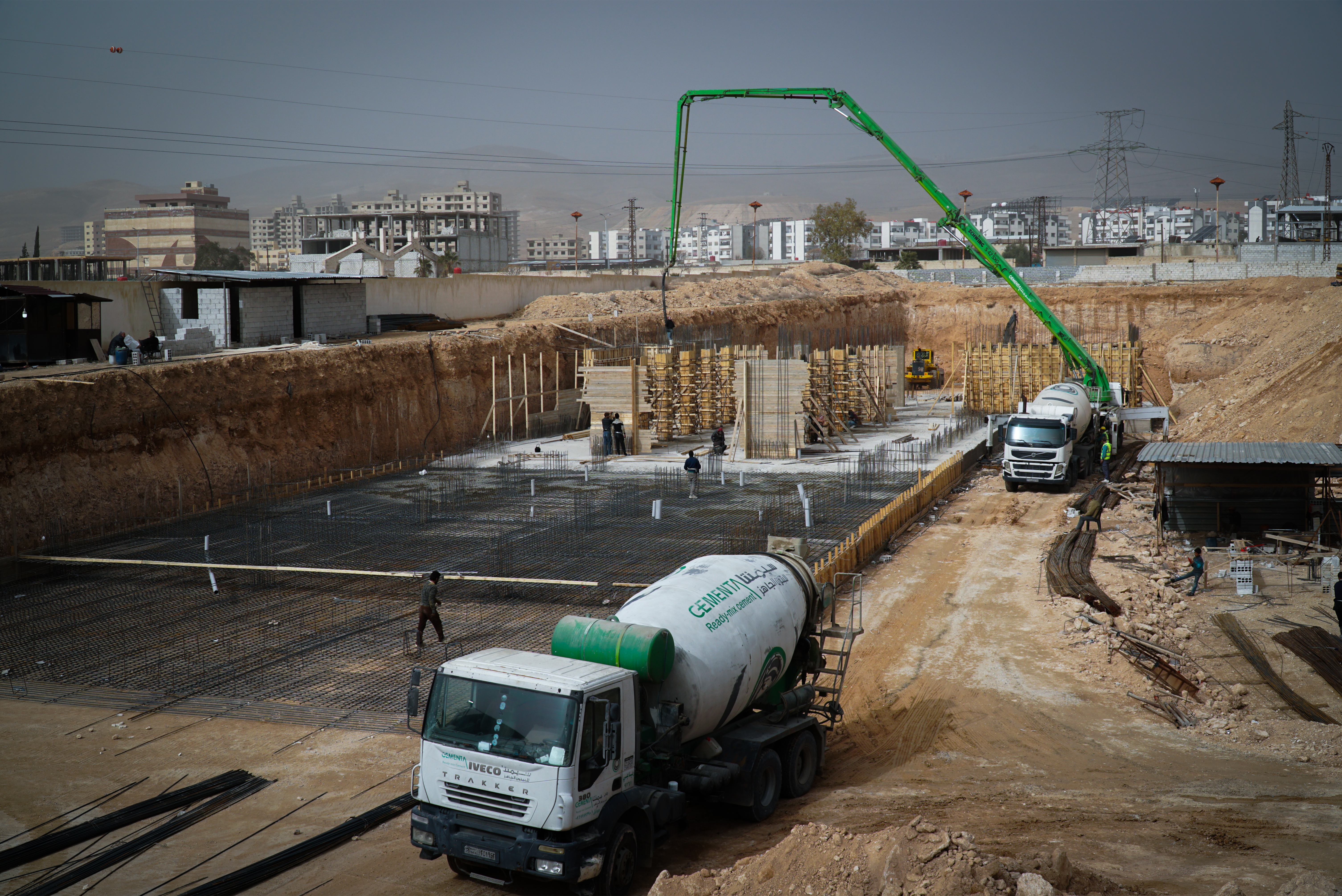 Concrete pump near high-rise buildings